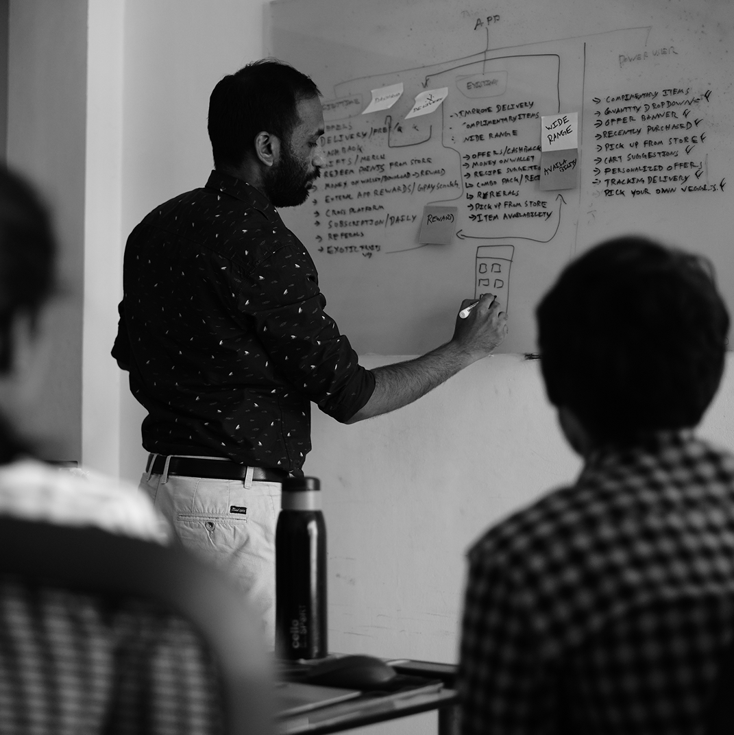 Mapping a user flow on a whiteboard in a team workshop